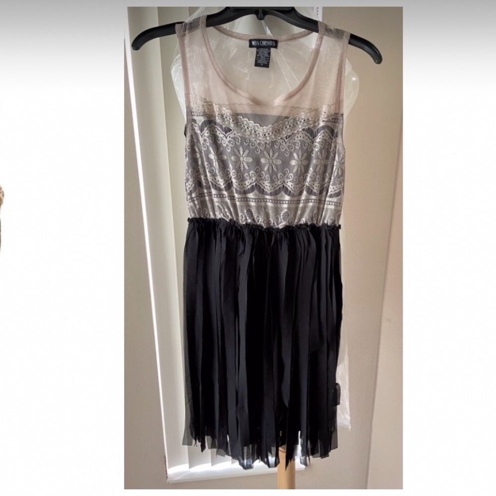 Sexy Mis chevous nude & black strechy with frills mini dress size small